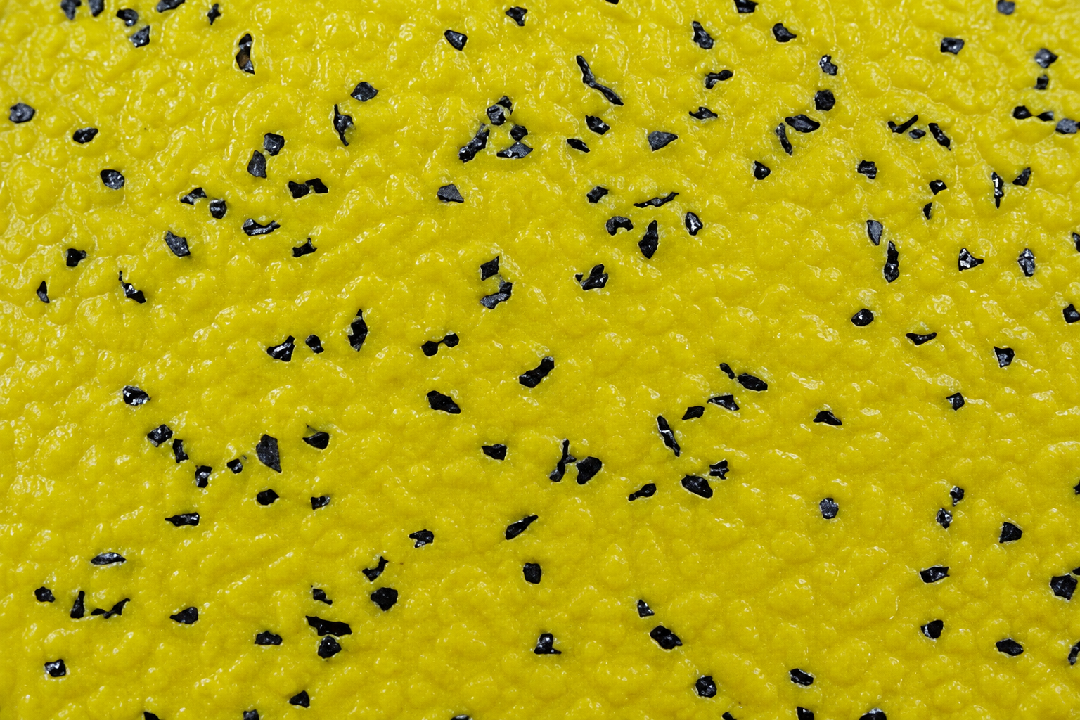 Textura amarilla con granulado negro